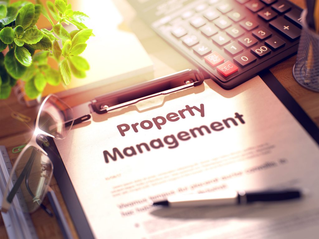 Business Concept - Property Management on Clipboard.